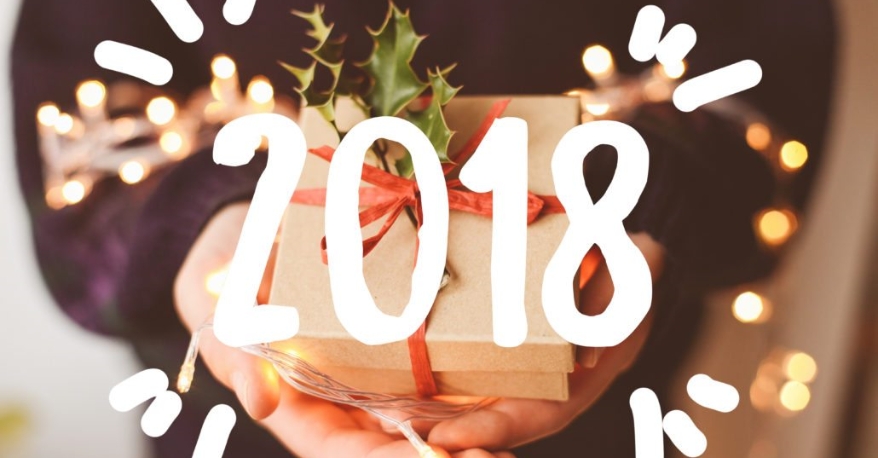 Hands Holding A Gift With 2018 Super Imposed Over Top
