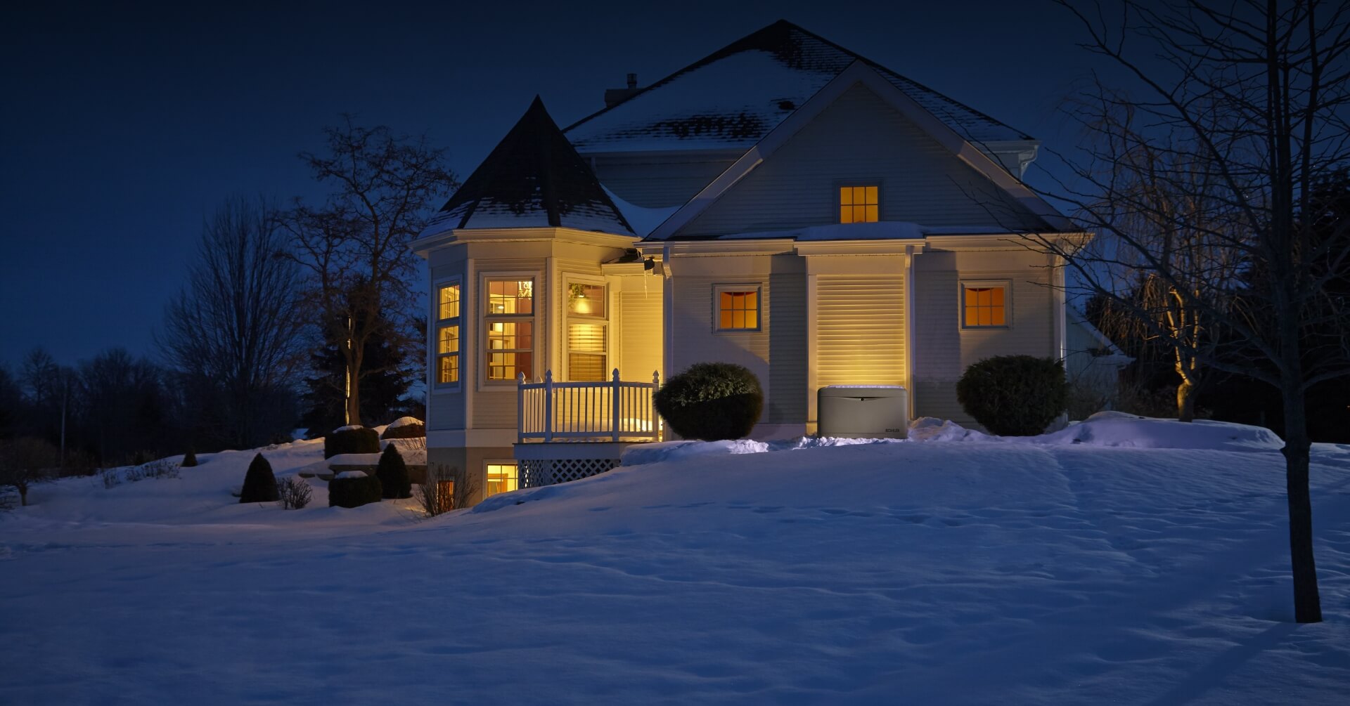 Snowy_House A snowy house with the lights still on thanks to a standby generator