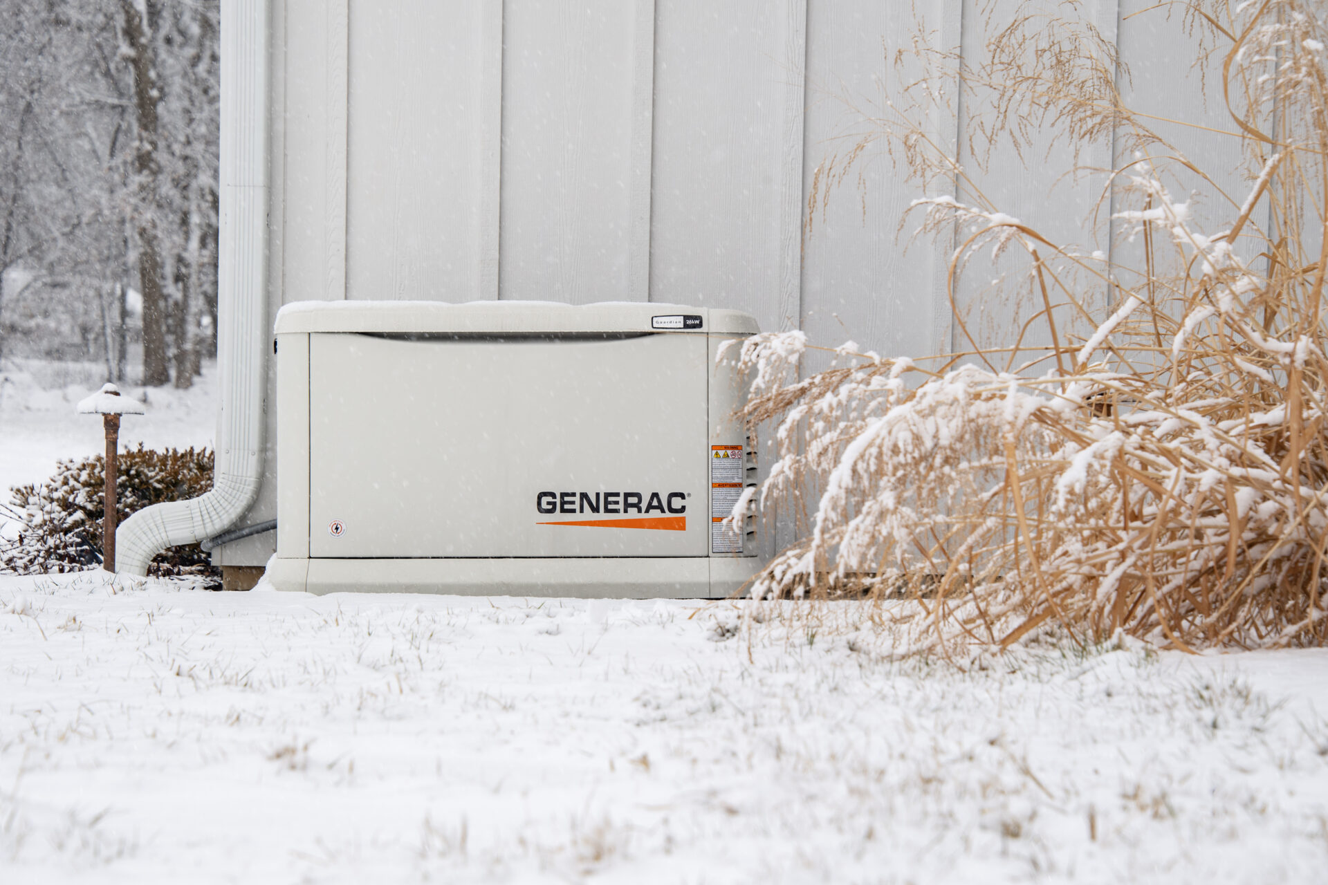 generator next to home in the snow
